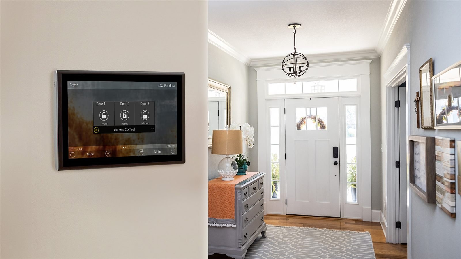 A wall-mounted touchscreen controlling lights and music in a bright entryway